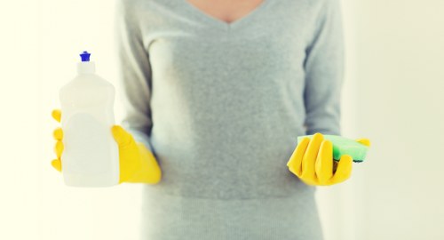 Cleaning technician treating carpets in a Marks Gate business premises